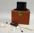 Mans Top Hat in Leather Case a Carved Ivoryhandled Parasol and a Group of Mostly Ivory and Bone Sewing Implements
