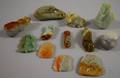 Approximately Twentyfive Small Chinese Carved Jade Pendants