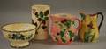 Two Majolica Pitchers a Footed Bowl and a Vase