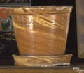 Orange and yellow glazed redware flower pot and undertray