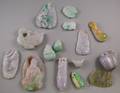 Approximately Twentythree Asian Carved Jade and Stone Pendants