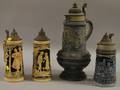 Four German Cobalthighlighted and Glazed Molded Stoneware Beer Steins