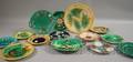 Fourteen Assorted Majolica Glazed Decorated Ceramic Plates and Dishes