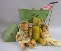 Two Painted Dolls an Articulated Cloth Teddy Bear and a Greenpainted Wicker Dolls Carriage