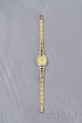 Ladys 18kt Gold Emerald and Diamond Wristwatch Baume  Mercier