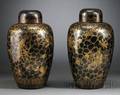 Pair of Black Glazed and Gilt Covered Jars