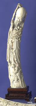 Large carved ivory figure of a scholar