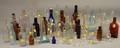 Approximately Fiftyfive Assorted Mostly Colorless and Brown Amber Molded Glass Bottles