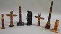 Seven Wooden Painted Tourist Totem Poles
