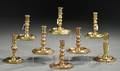 Eight Similar Brass Candlesticks