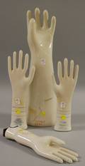 Large Porcelain Linemans Glove Form and Three Porcelain Ladys Glove Forms