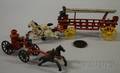 Two Cast Iron Fire Toys