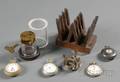 Assorted Watch and Movement Holders and Four Pocket Watches