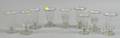 Nine Colorless Blown Glass Footed Syllabubs
