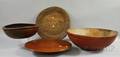 Two Large Redpainted Turned Wood Bowls a Large Hewn Wooden Charger and a Cherry Lazy Susan