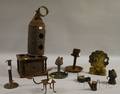 Nine Early Tin and Wrought Iron Lighting Devices and a Footwarmer