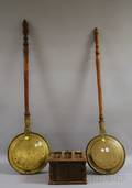Two Brass Bedwarmers with Turned Wood Handles and a Punched Tin and Wooden Footwarmer