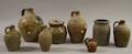 Five Stoneware Jugs a Small Crock Jar and Glazed Redware Jug