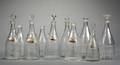 Ten Colorless Blown Engraved and Cut Glass Decanters