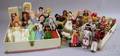 Collection of Mid20th Century Souvenir Dolls a Composition Doll and Four Painted Heads