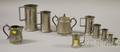 Eight Pewter Measures and a Creamer and Sugar