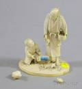 Japanese Ivory Okimono of a Man Boy and Quails