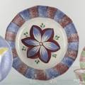 Red and blue rainbow paneled plate