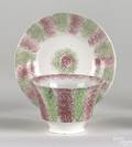 Red and green rainbow spatter cup and saucer