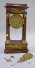 French Empirestyle Ormolumounted Mahogany Portico Mantel Clock
