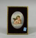 Handpainted Oval Porcelain Plaque Depicting a Putto