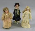 Three Small Bisque Dolls on Stands
