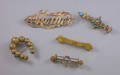 Five Gold and Goldtone Victorian Brooches