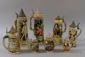 Eight Assorted German Stoneware Steins and Flagons