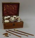 GermanAustrian Marquetry Decorated and Veneered Cased Elevenpiece Gilt and Grisaille Decorated Porcelain Tea Set