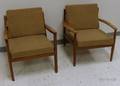Two Danish Modern Upholstered Teak Lounge Chairs