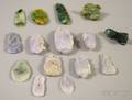 Approximately Fifteen Asian Carved Jade and Stone Pendants