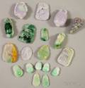 Approximately Eighteen Asian Carved Jade and Stone Pendants