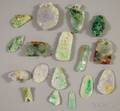 Approximately Sixteen Asian Carved Jade and Stone Pendants
