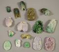 Approximately Sixteen Asian Carved Jade and Stone Pendants