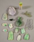Approximately Fifteen Asian Carved Jade and Stone Pendants and other Items