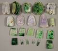 Approximately Seventeen Asian Carved Jade and Stone Pendants