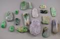 Approximately Sixteen Asian Carved Jade and Stone Pendants