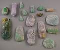 Approximately Seventeen Asian Carved Jade and Stone Pendants