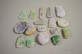 Approximately Sixteen Asian Carved Jade and Stone Pendants