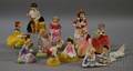 Twelve Small Royal Doulton Porcelain Figures of Girls and Young Women