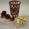 Large Bohemian Etched Ruby Flash Glass Tumbler and a Set of Four Cordials and a Set of Seven Enameled Fishdecorated Glass Cordials