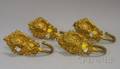 Set of Four Empire Gilt Stamped Brass Curtain Tiebacks