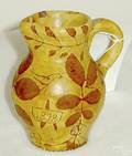 Sgraffito decorated redware miniature pitcher possibly Montgomery County Pennsylvania
