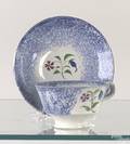 Miniature blue spatter handled cup and saucer