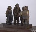 Pennsylvania folk carving of four tradesmen talking